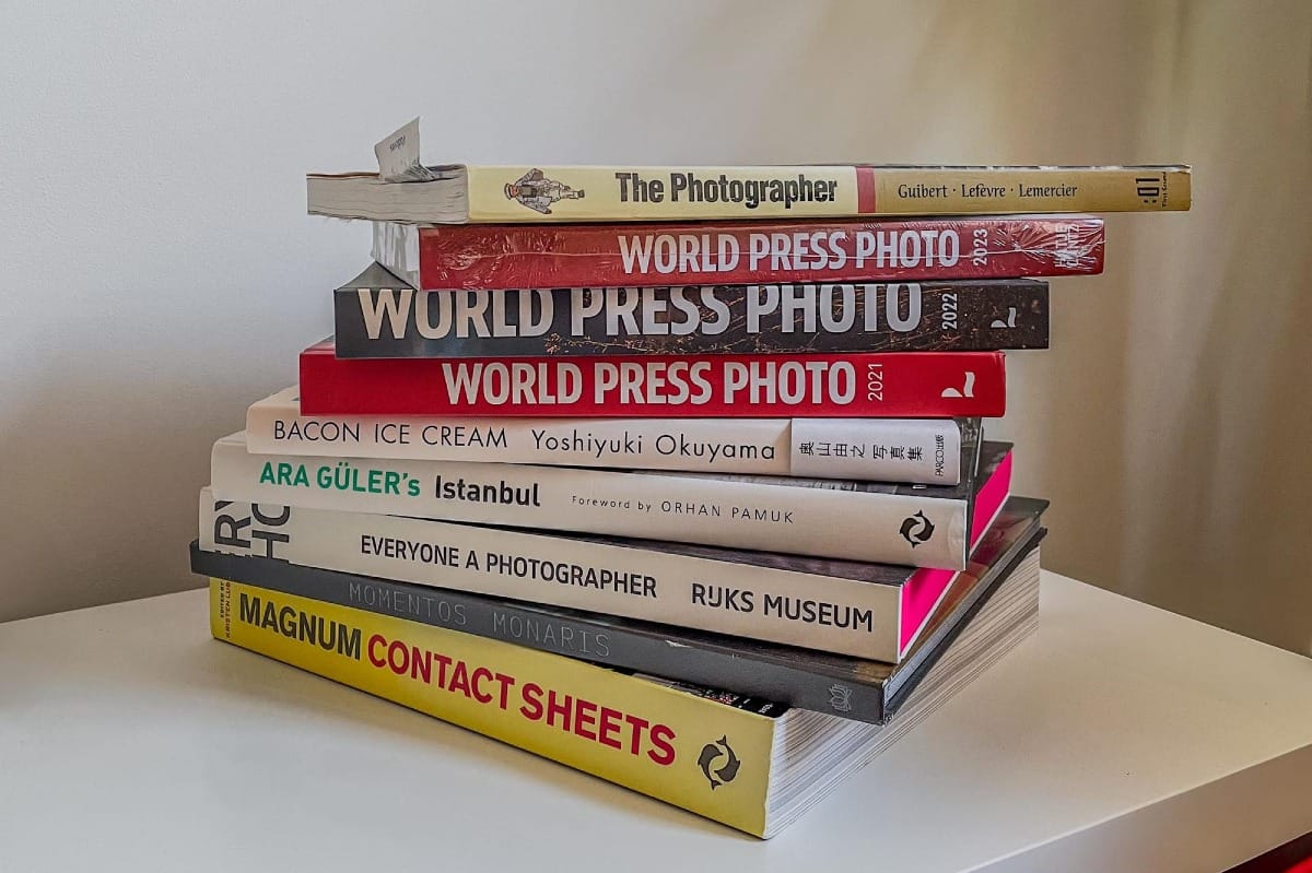 Photography books stacked on top of eachother.