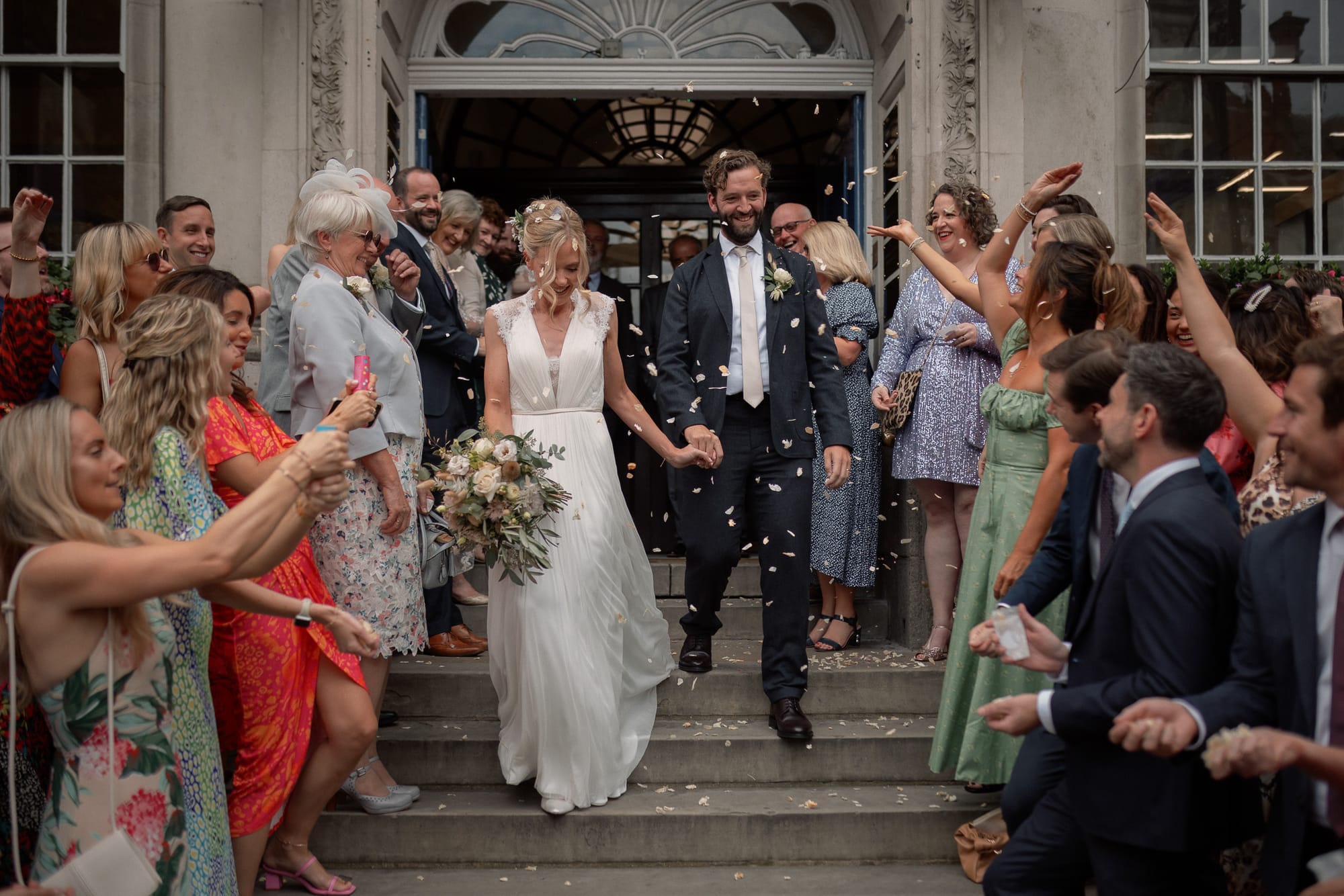 Newlyweds showered in confetti as they leave their weding in London