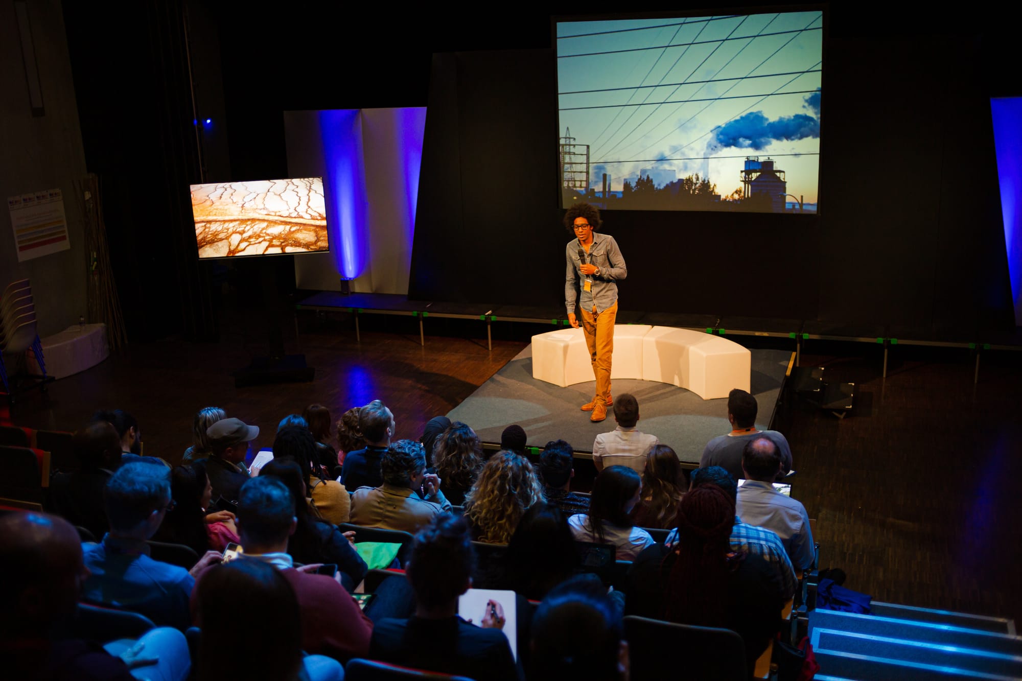 Speaker talking to an audience at a photography festival