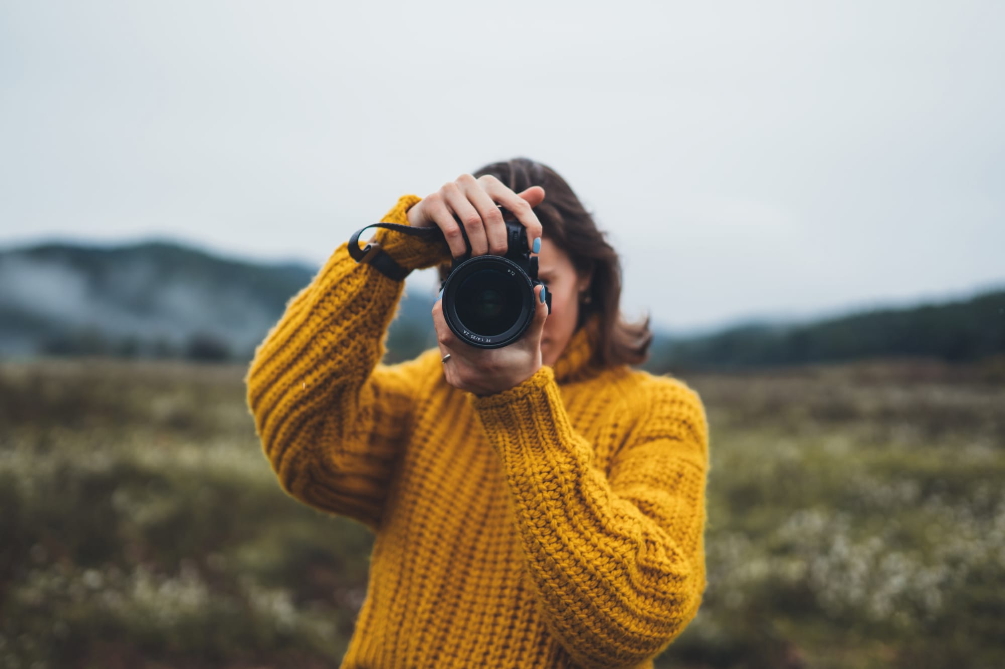 Photographer holding a camera 