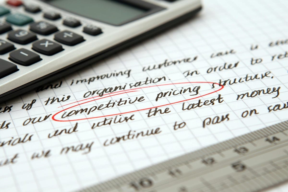 Writing on paper that reads: competitive pricing